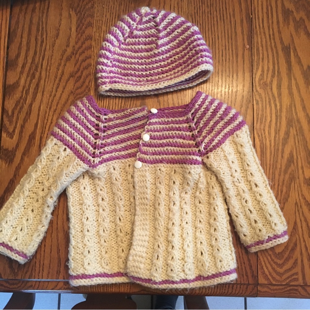 Matching handmade baby sweater and hat
